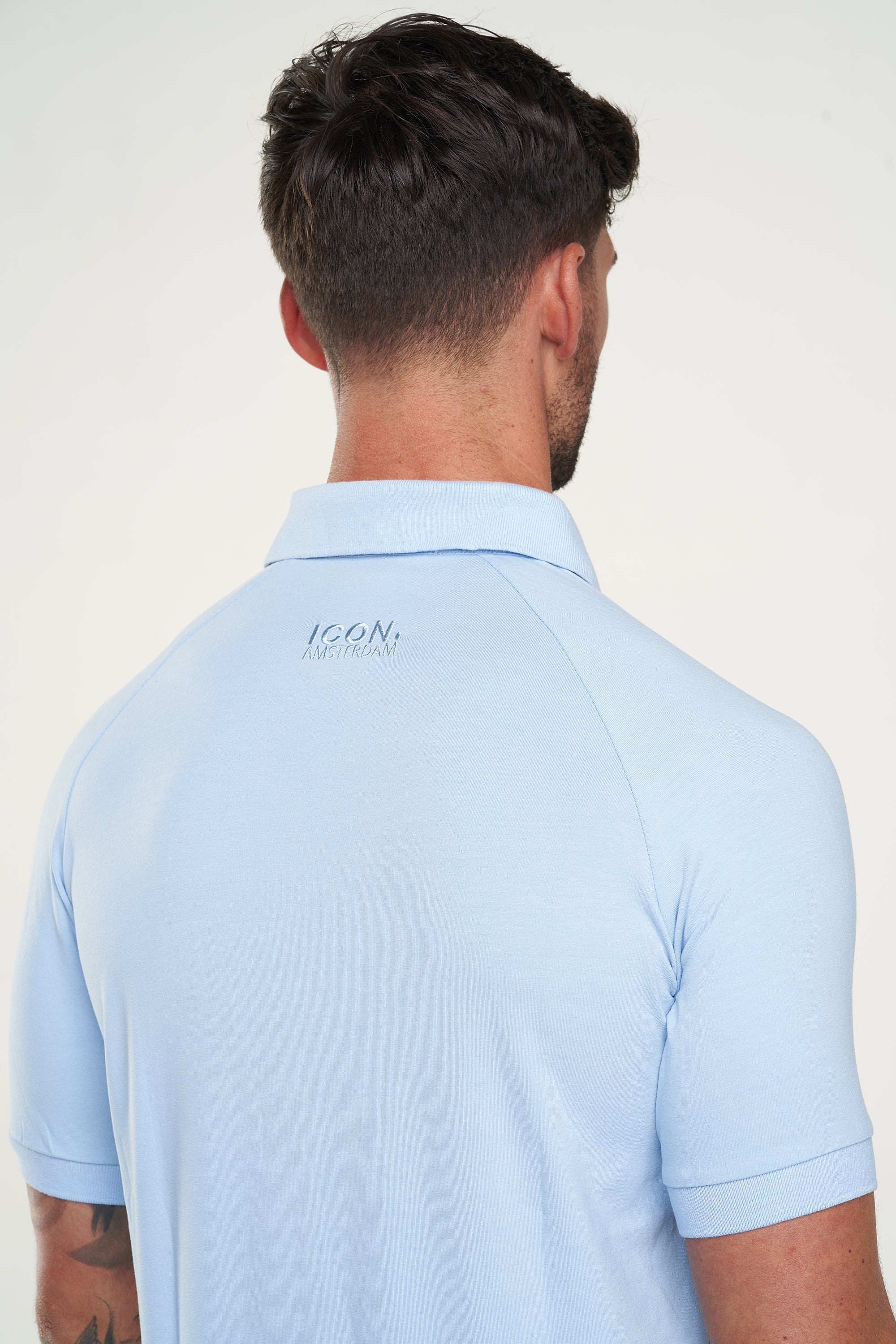 THE MUSCLE BUTTON POLO