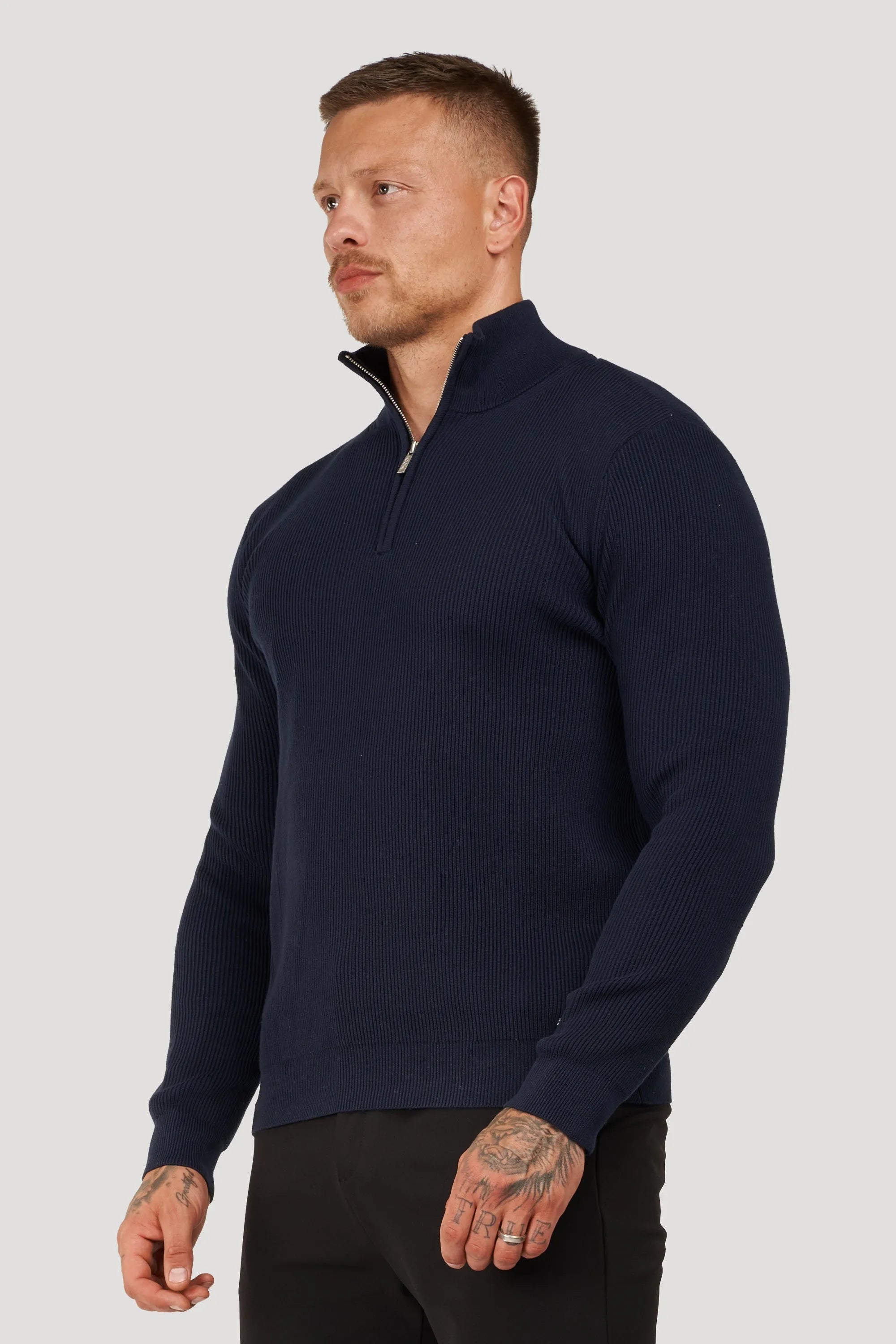 THE RENZO HALF ZIP SWEATER