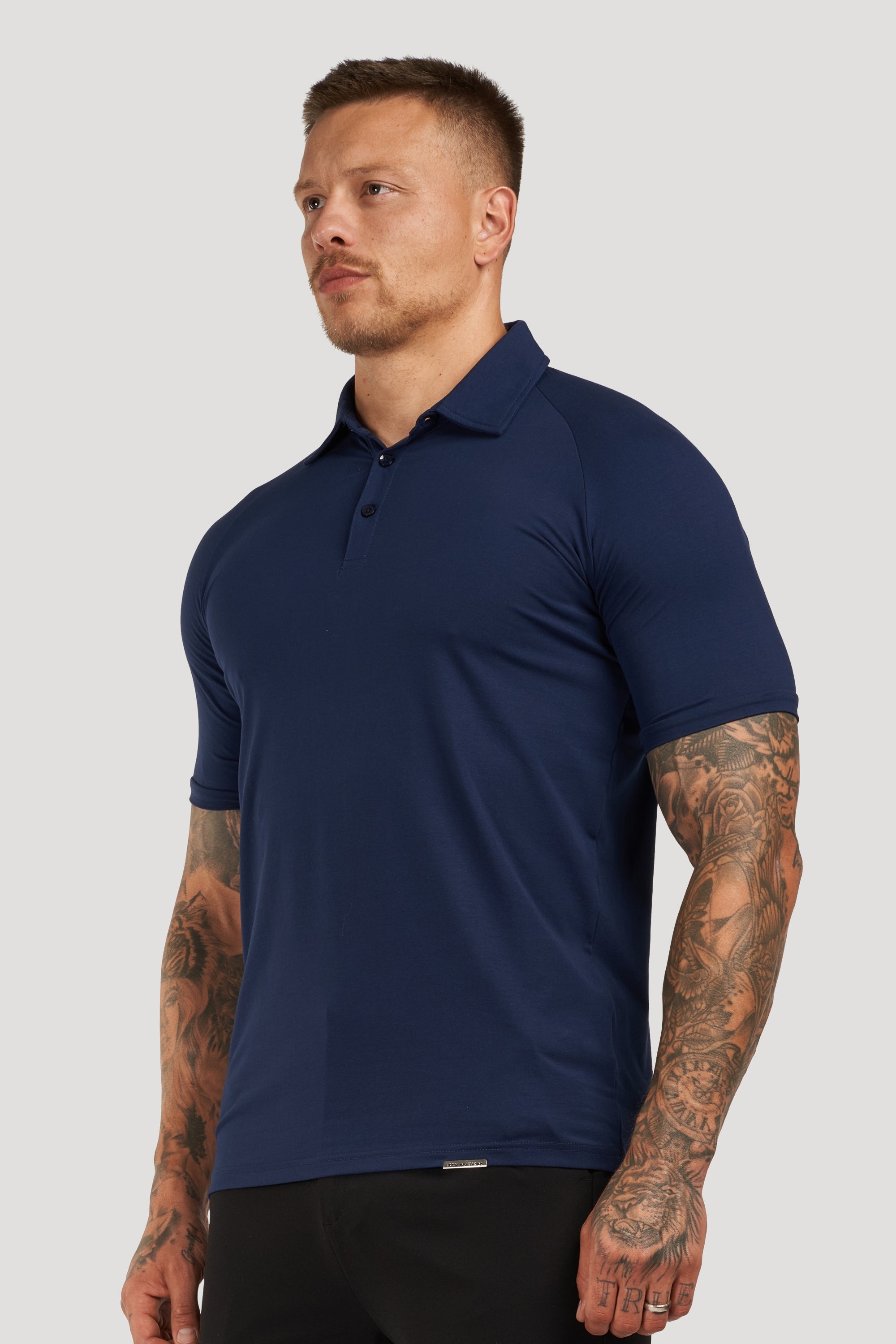 THE MUSCLE BUTTON POLO