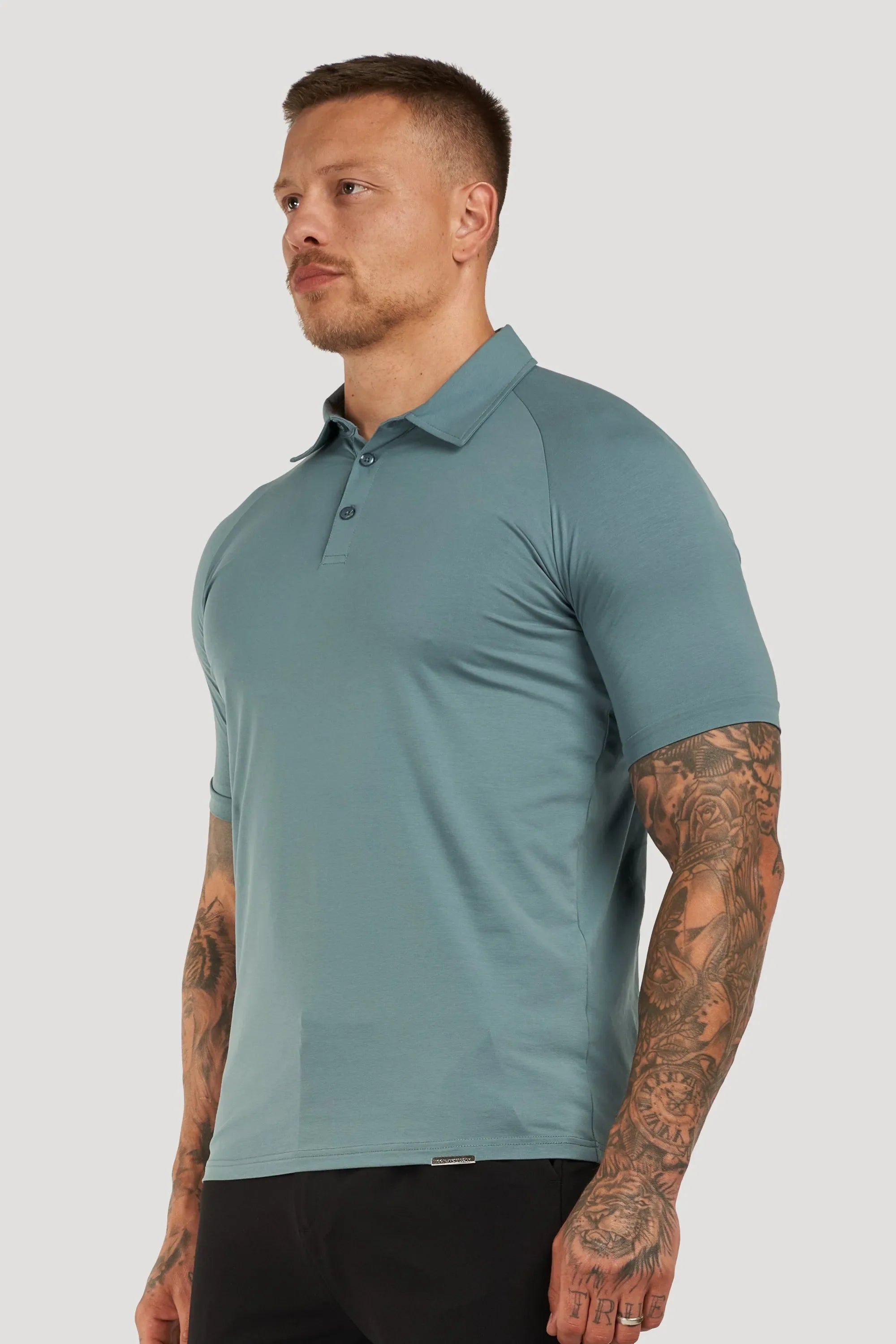 THE MUSCLE BUTTON POLO