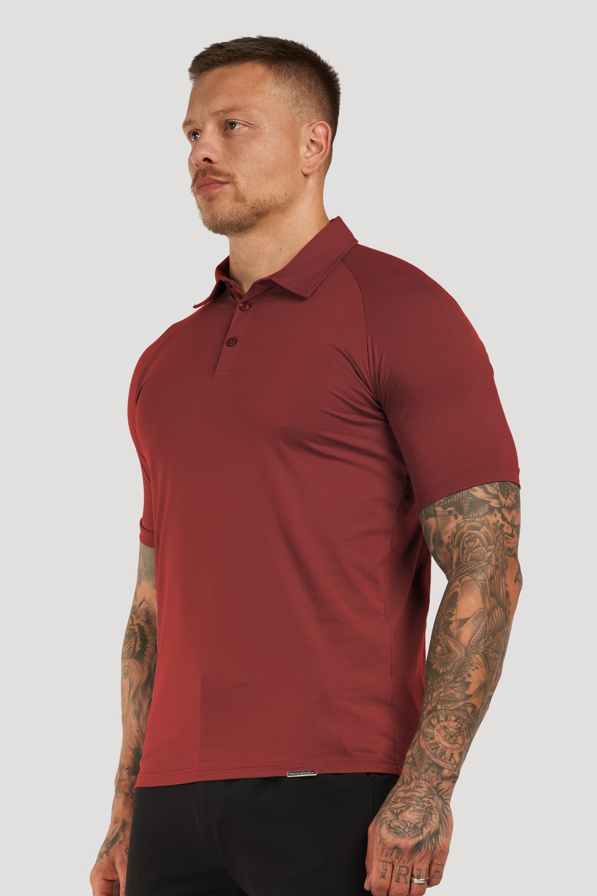 THE MUSCLE BUTTON POLO